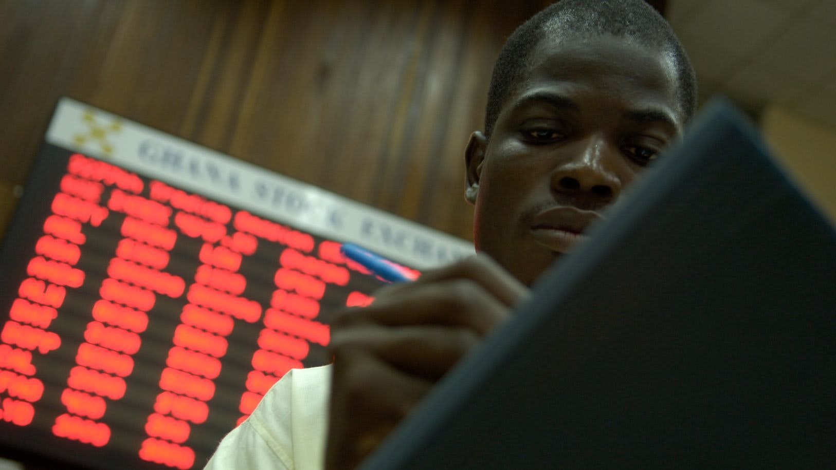 A man taking notes at the Ghana Stock Exchange in Accra, Ghana